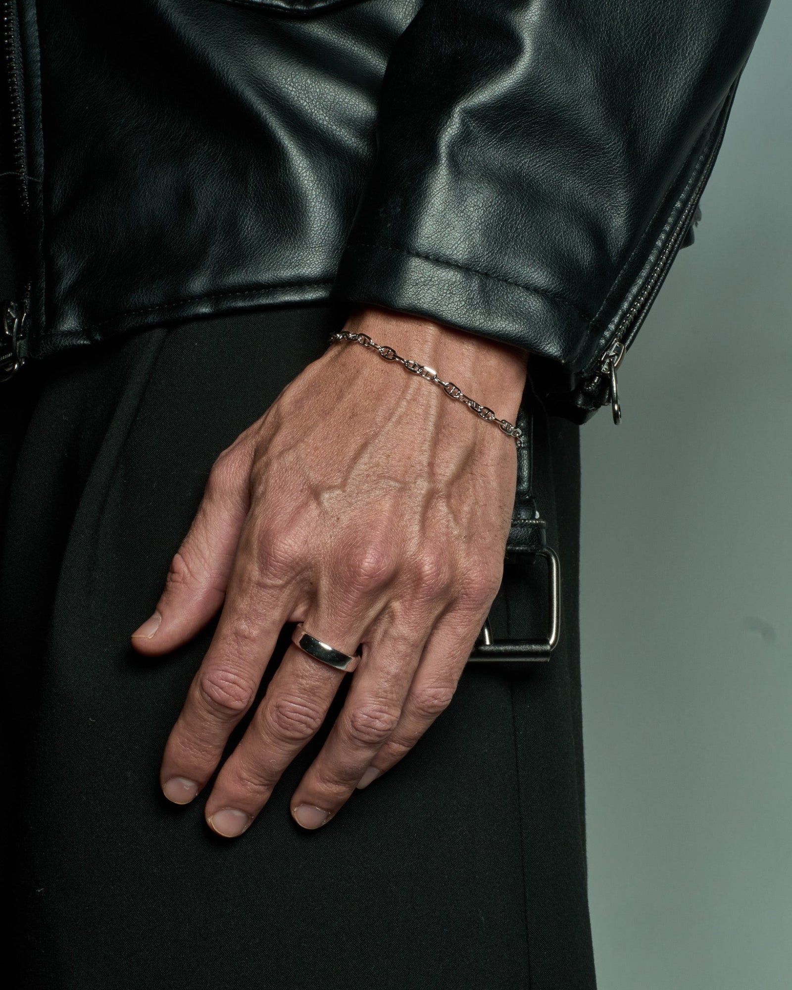 Infinite bracelet worn on a model's wrist 1.