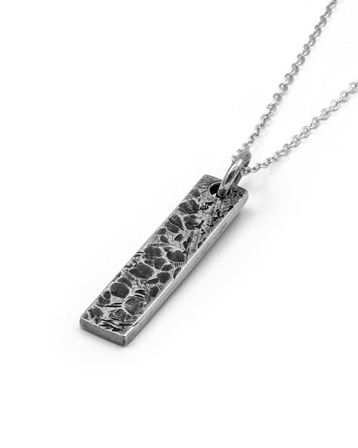 Levi Pendant handcrafted from solid 925 sterling silver featuring an organic textured dog tag design.