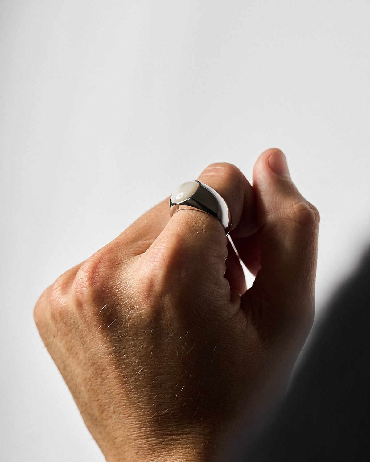 Model wearing the M.O.P Ring handcrafted from solid 925 sterling silver featuring genuine mother of pearl.