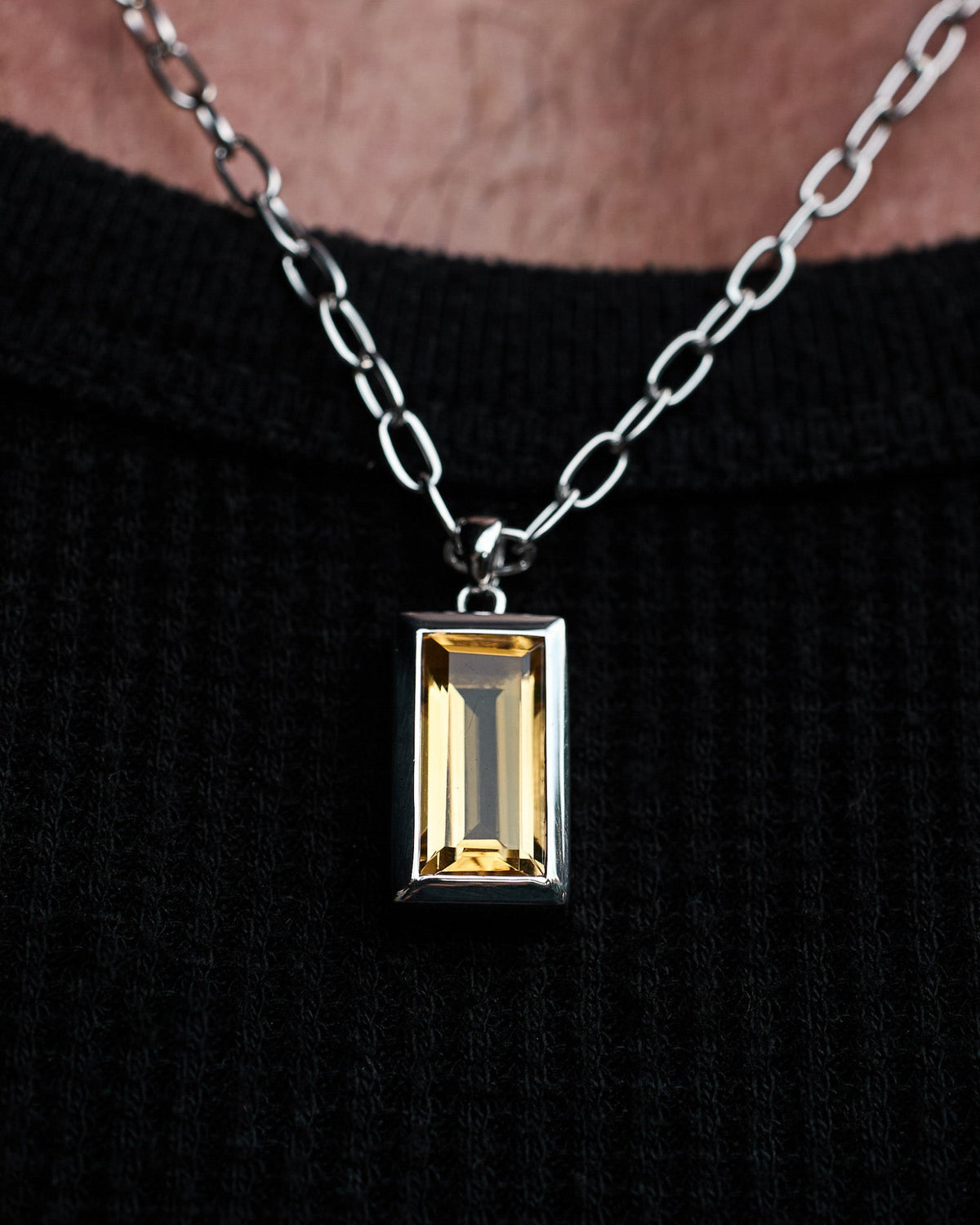 Close-up of the Sona Citrine Pendant featuring a citrine-coloured stone set in solid 925 sterling silver.
