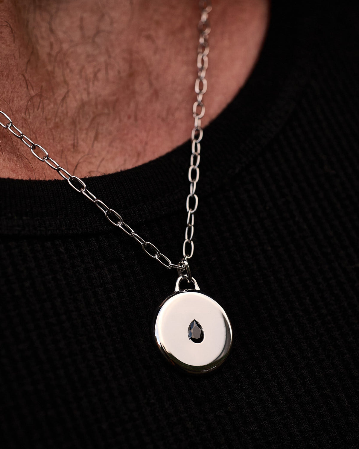 Model wearing the Teardrop Pendant handcrafted from solid 925 sterling silver on a sterling silver necklace.