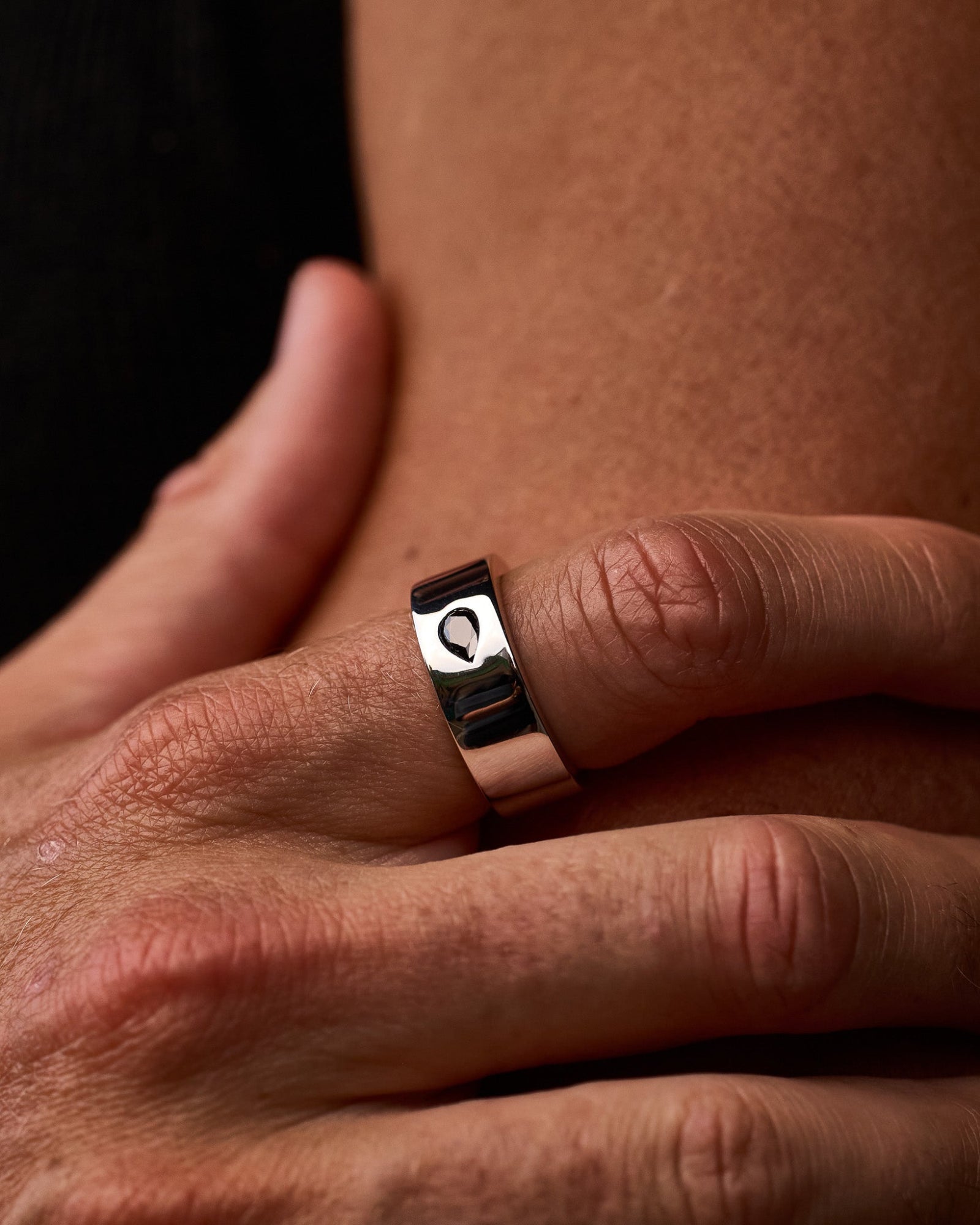 Teardrop ring worn on a model's hand 1