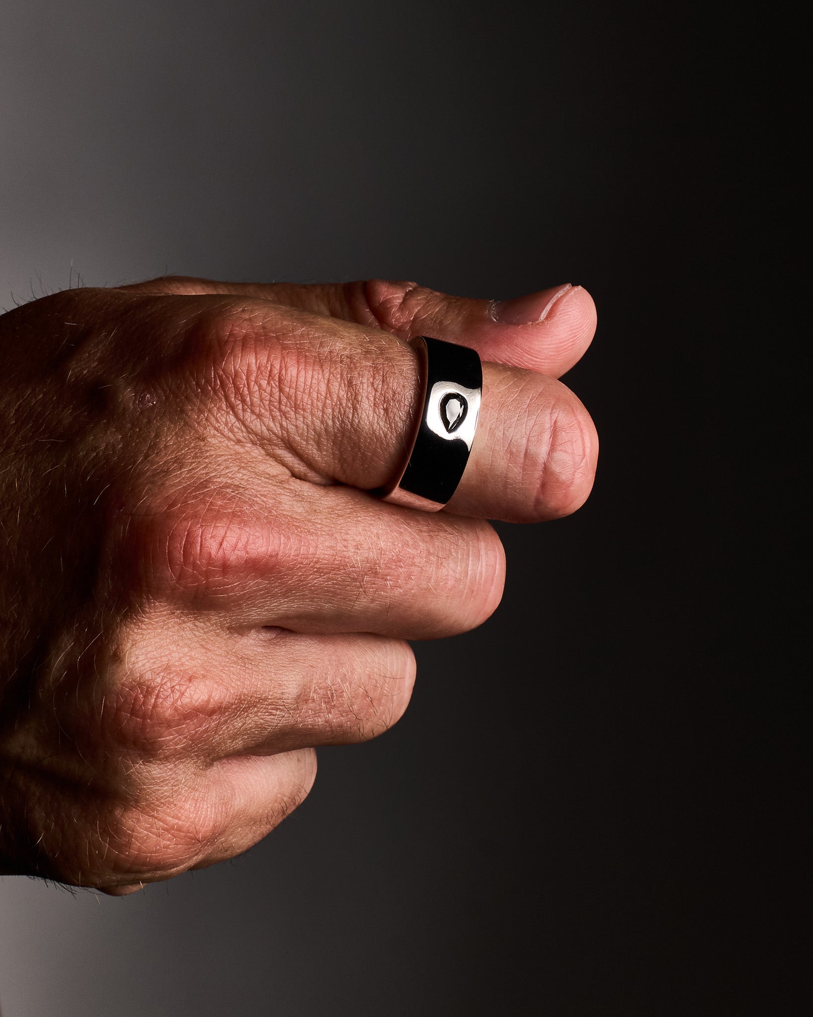 Teardrop ring worn on a model's hand