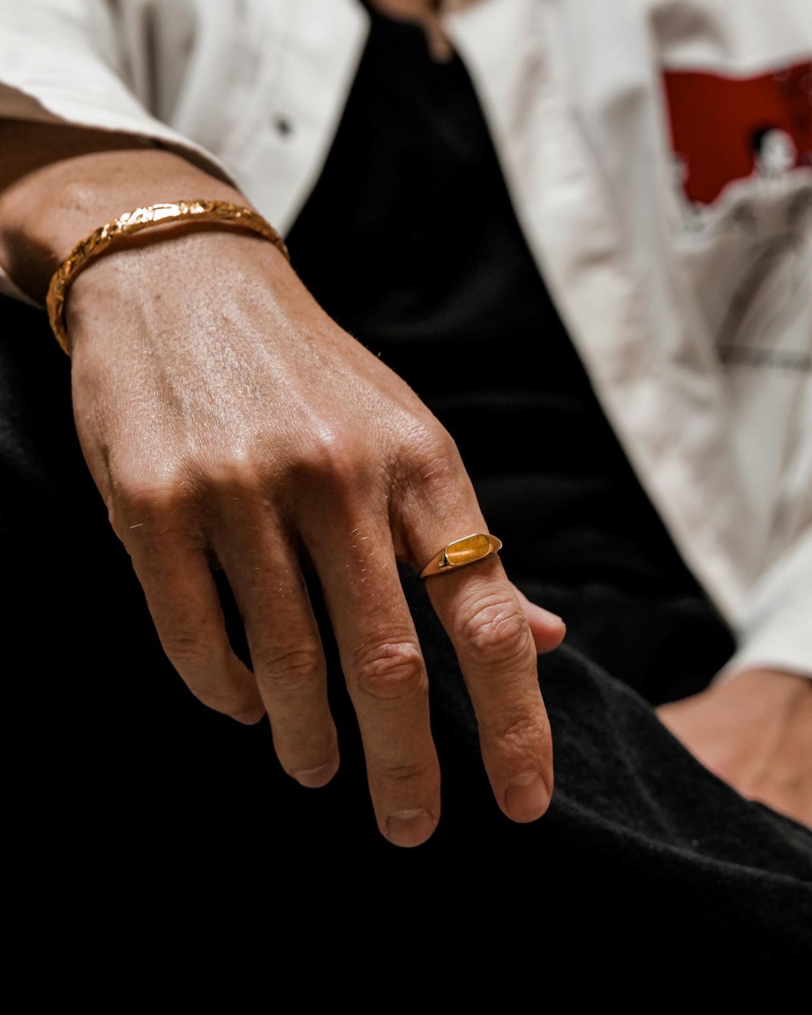 Tigers eye ring worn on a model's hand