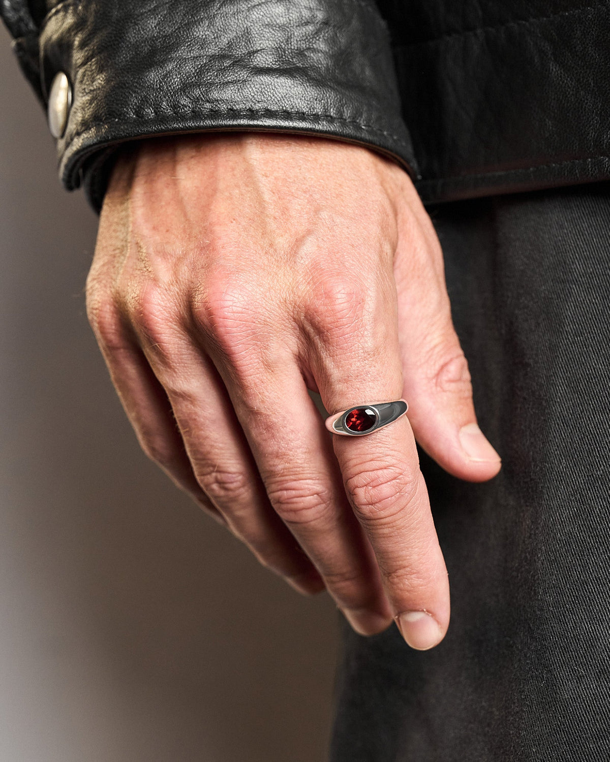 Model wearing the Yuki Red Garnet Ring handcrafted from solid 925 sterling silver featuring genuine red garnet.